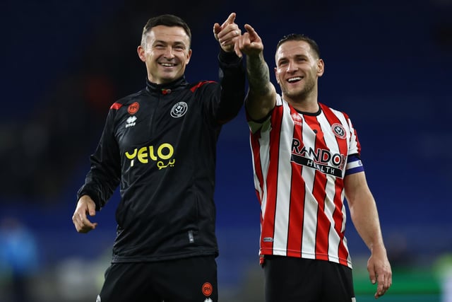 Boss Paul Heckingbottom and skipper Billy Sharp point out people in the away end after victory at Cardiff