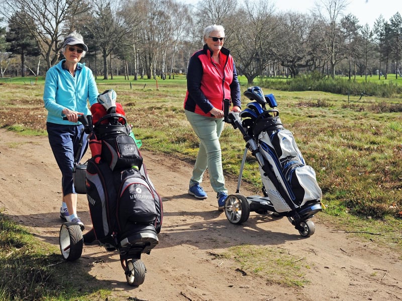 Jen Rowland and Kim Turner make their way to the tee.