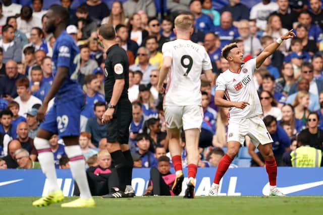 Sheffield United's Callum Robinson (right) celebrates scoring his side's first goal of the game during the Premier League match at Stamford Bridge, London, last season: John Walton/PA Wire.