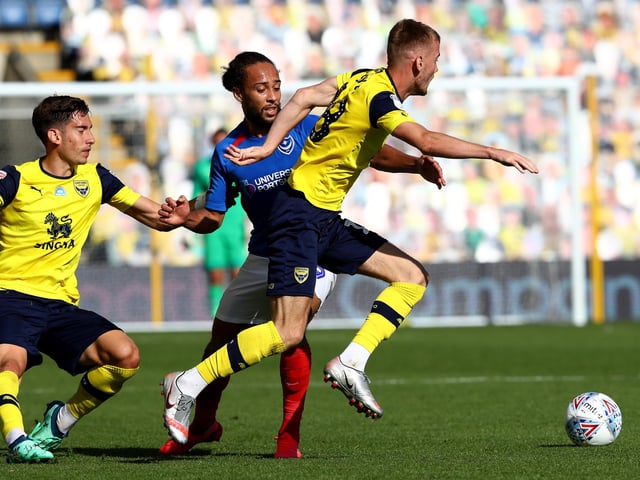 Marcus Harness goes in for a tackle during the first half