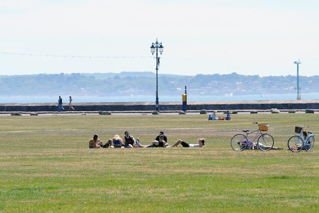 People were socially distancing on Southsea Common on Thursday, May 21 - the hottest day of the year. Picture: Sarah Standing (210520-2435)