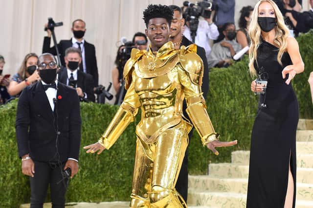 Lil Nas X had two outfit changes at the Met Gala 2021. Photo by: ANGELA WEISS/AFP via Getty Images.
