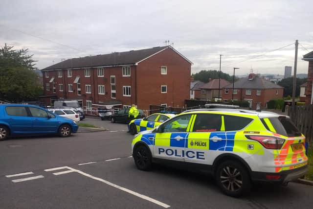 Police oficers at the cordon in Heeley, Sheffield, this morning