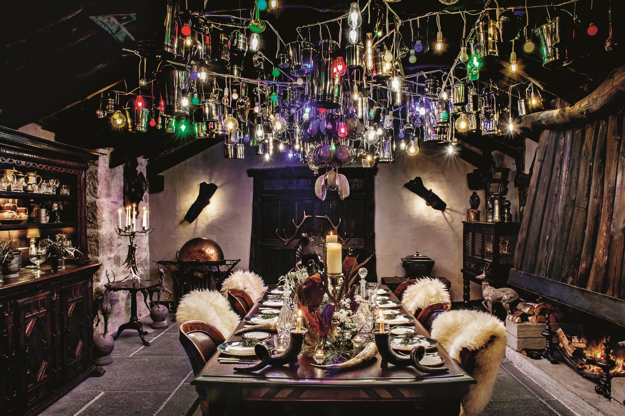 Subodh Gupta’s dazzling, multicoloured Sharing Your Light (2018) hangs over the eighteenth-century dining table.