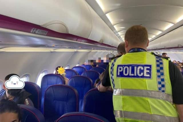 A man who attacked staff at Sheffield railway station has been arrested at the airport. British Transport Police are pictured on an aerolplane.