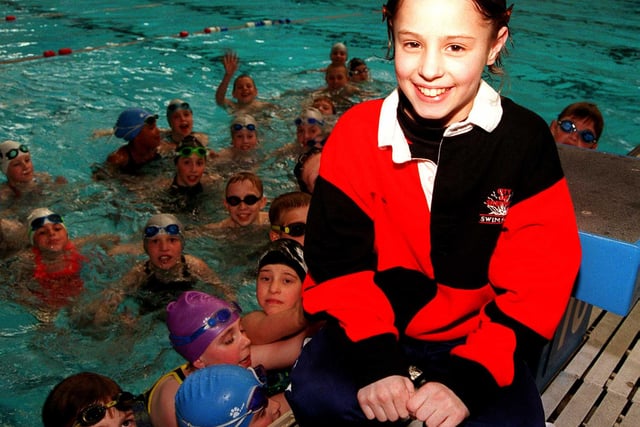 Pictured at Ponds Forge Swimming Pool is City of Sheffield Swimming Squad member Gabbie Ashcroft 11 in 1999 who has raised £2440 from a sponsored swim for the Childrens Appeal. In the water are fellow squad members.