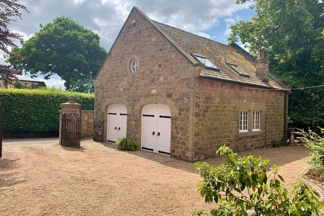The coach house has wo sets of timber doors, set within feature arched surrounds, which open into the oversized double garage which has power, lighting and windows.