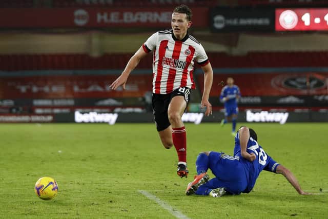 Sander Berge of Sheffield United, pictured tussling with Christian Fuchs of Leicester City, is always determined to stay on his feet: Darren Staples/Sportimage