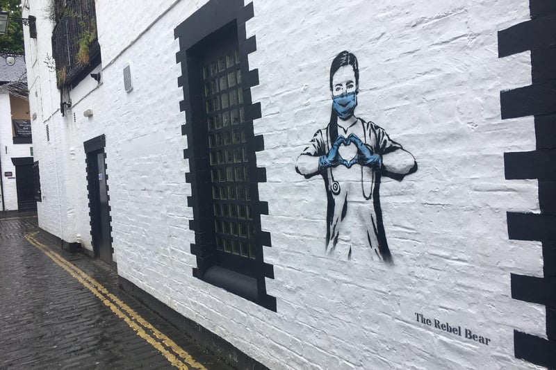 Street artist Rebel Bear's work appeared in Glasgow's Ashton Lane.