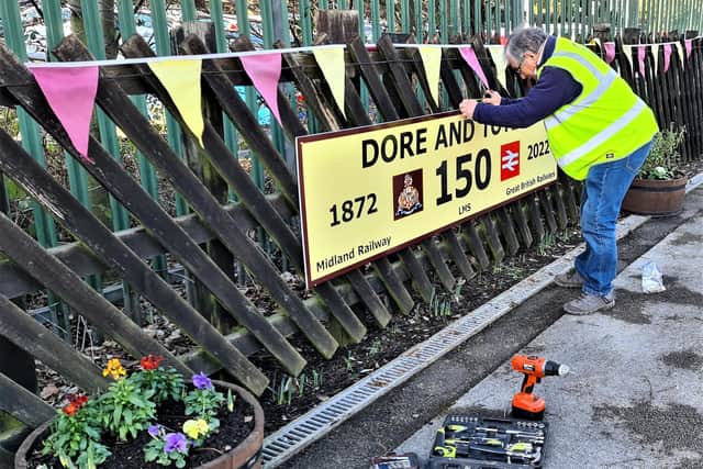 Bunting being put up at Dore and Totley Station to celebrate 150th anniversary.