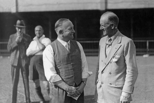 Herbert Chapman chats with G M Foster during a visit to Highbury on 6th September 1933 to create more football opportunities for children in the area.