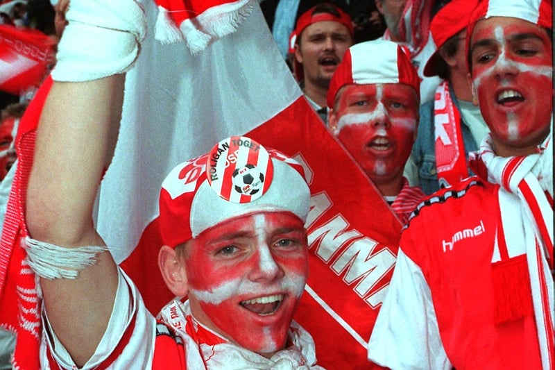 A young Danish fan waves goodbye to Sheffield and Euro 96 - despite his country beating Turkey 3-0 at Hillsborough, they failed to qualify for Euro 96