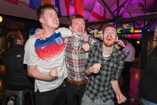 England fans celebrate while watching the Euro 2020 semi-final in The Common Room in Sheffield