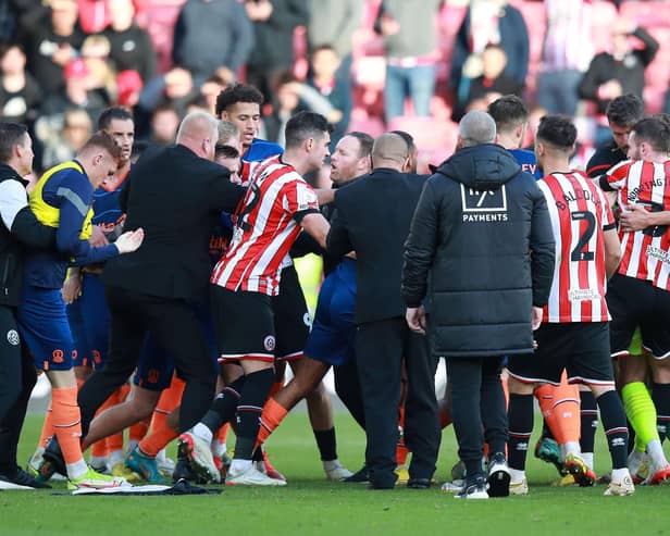 The skirmish that led to Wes Foderingham and Shayne Lavery seeing red after Sheffield United's draw with Huddersfield Town: Lexy Ilsley / Sportimage