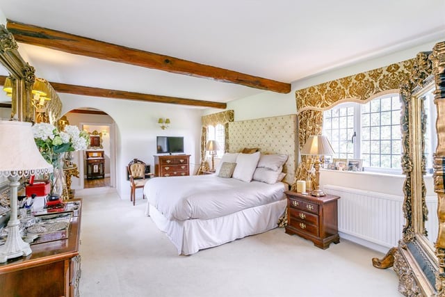 The master bedroom has views of the surrounding countryside both front and rear - doors lead to an en-suite WC and bathroom.