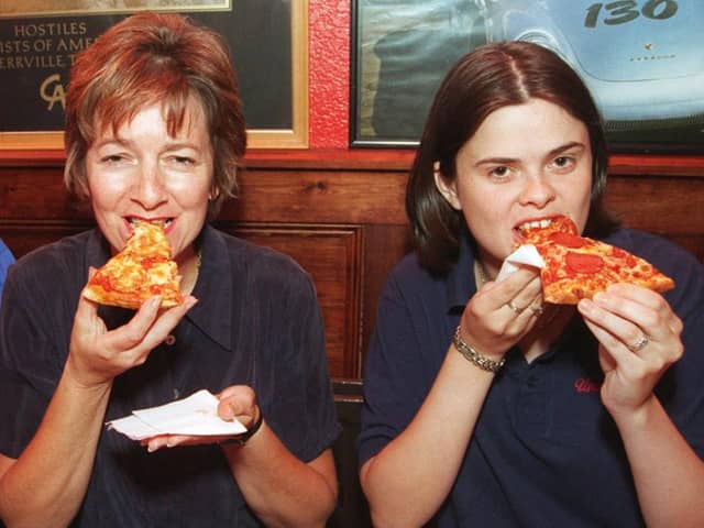 At Uncle Sam's CHuck Wagon restaurant in 1996 where staff were seeing tucking into pizza chef Lee Hunt, Susan Crossland and Caroline Haley.