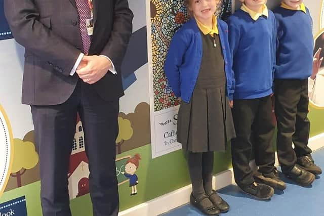 Rother Valley MP Alex Stafford with pupils at St Joseph's Primary School in front of the new mural