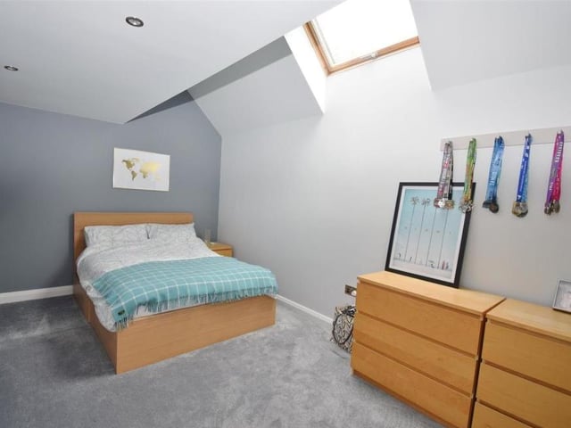 The second double bedroom boasts a vaulted ceiling, an upright radiator and a Velux window. You can also get to the loft space from this room.