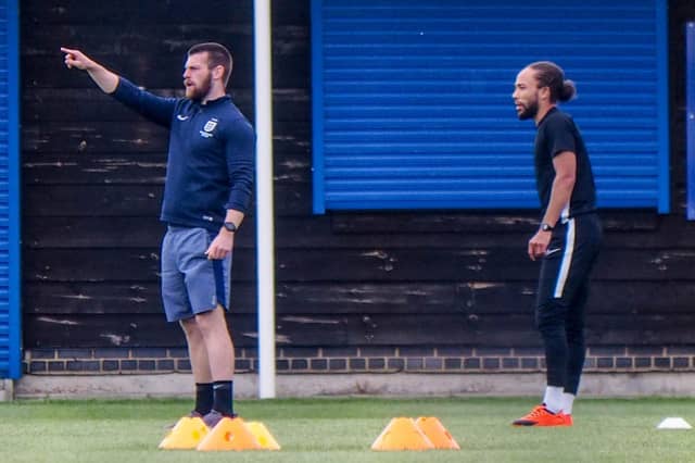 Physio Jack Hughes and Marcus Harness.