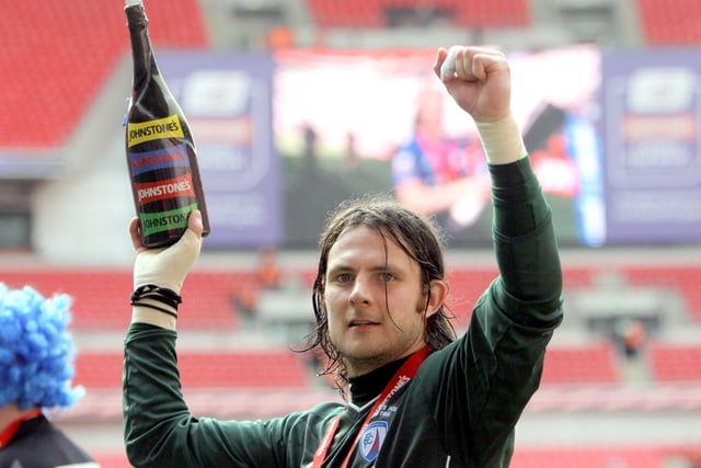Goalkeeper Tommy Lee celebrates on the Wembley pitch after the Spireites lift the JPT.