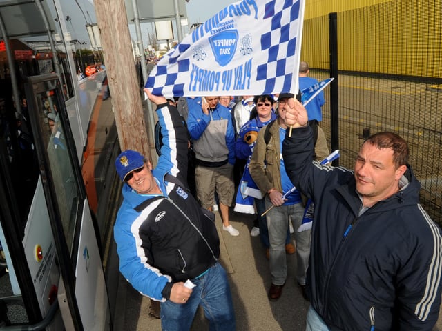 Fans getting on the bus for Wembley at Fratton Park.