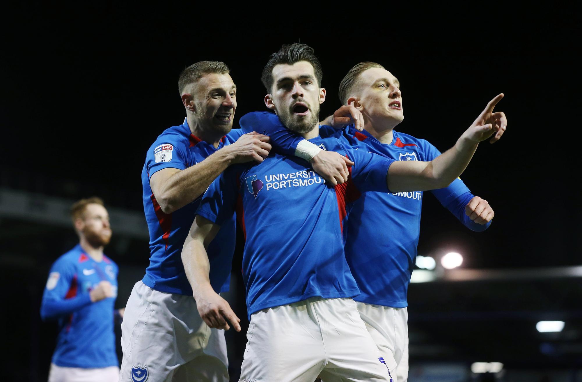 John Marquis celebrates with Lee Brown and Ronan Curtis