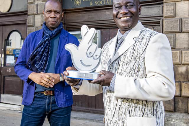 Sheffield environmental champion Maxwell Ayamba with a National Lottery Award presented by BBC journalist and Mastermind presenter Clive Myrie, as he visits the Sheffield & District African Caribbean Centre (SADACCA). 7 October 2021. Picture Tony Johnson