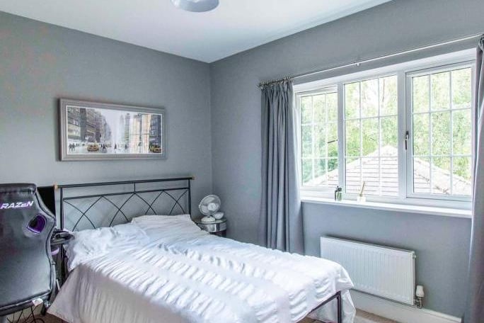 A double room with a front facing double glazed window and a central heating radiator.