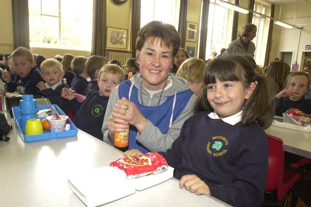 Pictured at  Woodseats Primary school, Chesterfield Road, Woodseats, where the Sheffield Dinner Lady of the year Jane Andrews is seen with Emily Miremadi, the pupil that  nominated her, back in 2002