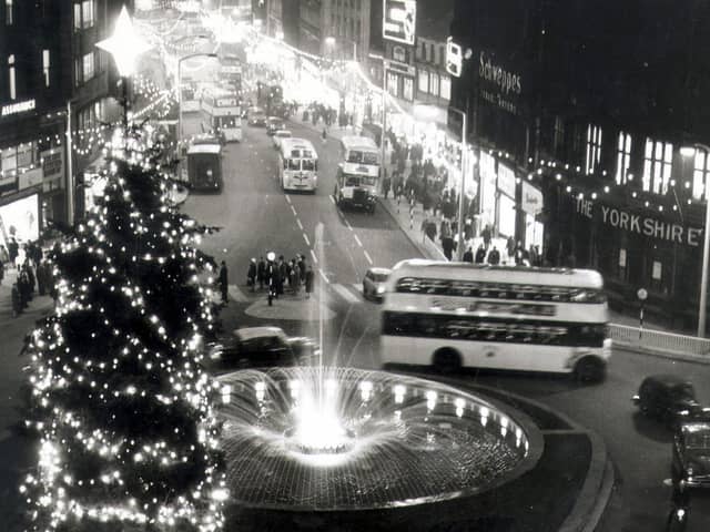 A view of the illuminations on Fargate, Sheffield, with the Goodwin Fountain in the foreground, 1961