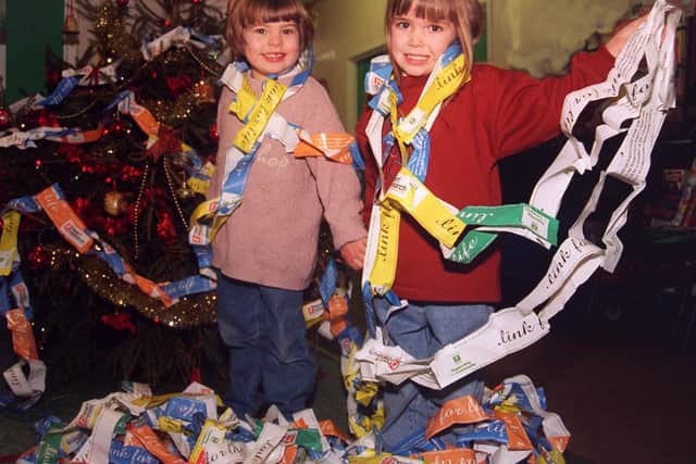 CHAINJT:
Chloe and Chelsea (4) wrap themselves and the Christmas Tree at the Childrens Hospital up in part of thje worlds longest Paperchain