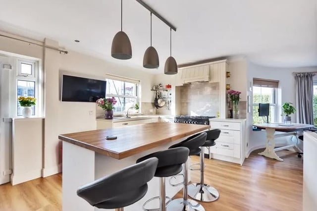 This four bedroom terraced home with views over Camber Dock, Old Portsmouth is on sale for £950,000. Here is the open plan kitchen.