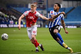 Scott Robertson of Fleetwood Town battles for possession with Mallik Wilks of Sheffield Wednesday. (Picture: Clive Mason/Getty Images)