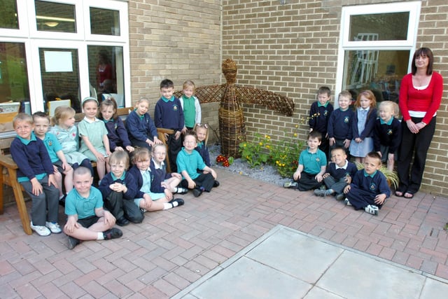 Year 1 pupils at Oxclose Primary School are pictured with the willow model they made of the Angel of the North, with teaching assistant Sharon Wilson who did much of the work with the students.