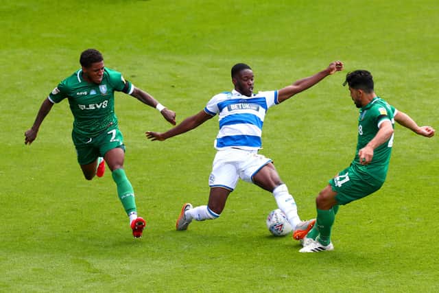 Olamide Shodipo up against Sheffield Wednesday's Massimo Luongo. (Photo by Clive Rose/Getty Images)