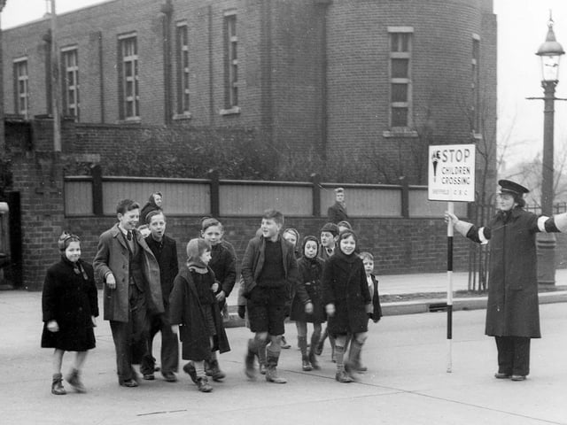 School crossing patrol, outside Saint Patrick's RC church, Barnsley Road, Sheffield Lane Top, circa 1940