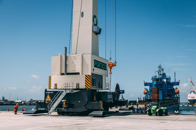The arrival of a new 432-tonne mobile harbour crane at Portico is captured.