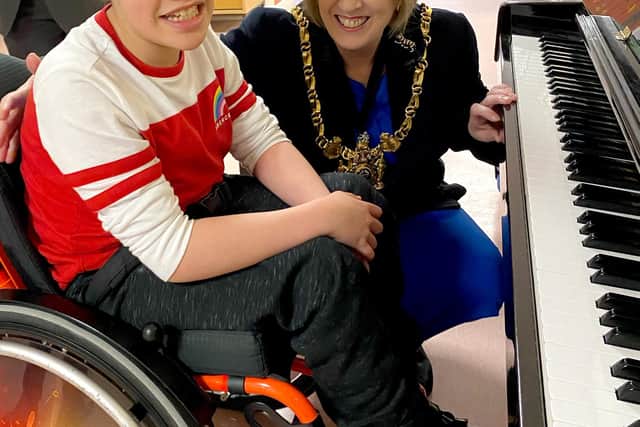 Sheffield's lord mayor, Councillor Gail Smith, at Paces School with 10-year-old pupil Lennie Street, who raised thousands of pounds during lockdown by playing his favourite tunes on the piano