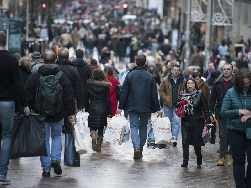 People carrying shopping bags on Buchanan Street in Glasgow's city centre. The city, with an average house price of £157,764, is rated No.2 in the top ten housing markets in the UK, with house price growth this year of 2.9 per cent. Picture: John Linton/PA Wire