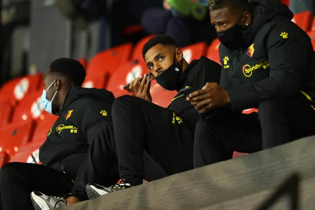 Danny Welbeck, Andre Gray and Pervis Estupinan of Watford look on from the stands during during Watford's opening day win against Middlesbrough.