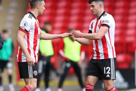 Sheffield, England, 23rd May 2021. John Egan of Sheffield Utd hands over the captains armband to Phil Jagielka of Sheffield Utd  during the Premier League match at Bramall Lane, Sheffield. Picture credit should read: Simon Bellis / Sportimage