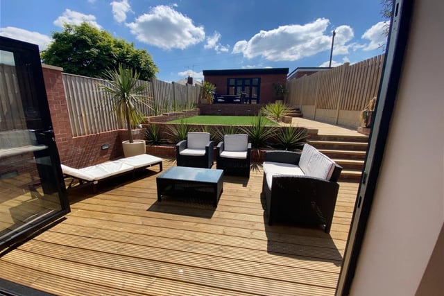Outside, there is a generous enclosed private rear South-facing garden that is beautifully landscaped featuring Indian sandstone paving, artificial grass, decking and outdoor lighting.