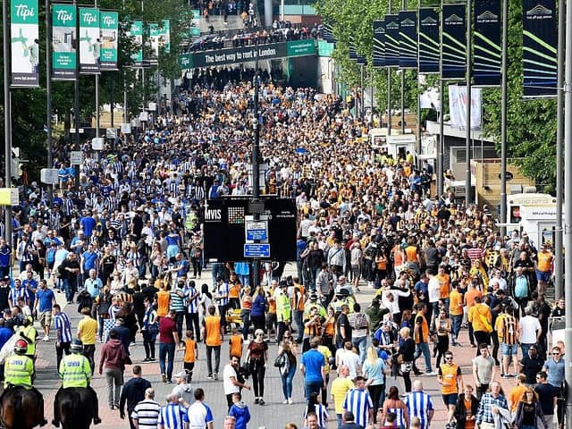 LONDON, ENGLAND - MAY 28:  Supporters make their way to the stadium prior to Sky Bet Championship Play Off Final match between Hull City and Sheffield Wednesday at Wembley Stadium on May 28, 2016 in London, England.  (Photo by Mike Hewitt/Getty Images)