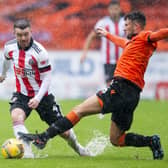 John Fleck in action against Dundee United at Tannadice illustrating the conditions which saw the match abandoned at half time with the Blades 1-0 up through Billy Sharp
