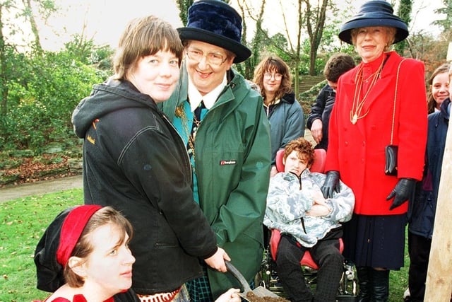 The Mayor of Doncaster Cllr Sheila Mitchinson plants a tree at the launch of HEAF at Hexthorpe Dell in 1998, assisted  by Lucy Nightingale from Travis Gardens and Trixie the Pixie. Also pictured are the Mayoress  of Doncaster Audrey Gregor from and Andrea Martin(wheelchair) who attends Travis Gardens.