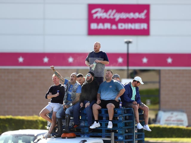 Portsmouth fans watching the game from a car park