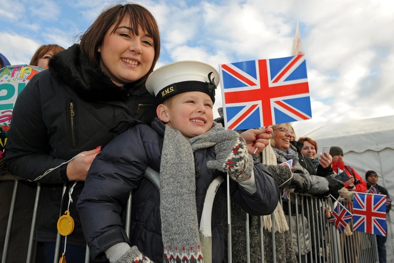 22nd November 2013. 
Families and well wishers welcome the Royal Navy destroyer HMS Dragon back to Portsmouth following it's recent deployment to The Indian Ocean and The Mediterranean. Kayleigh Tomlin from Portsmouth waits with her son Charlie Tomlin (six), for his brother Lewis who is onboard.
Picture: Ian Hargreaves  (133207-14)