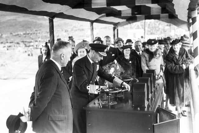 His Majesty King George VI turns the valve control wheel to officially open the Ladybower Reservoir on September 25, 1945