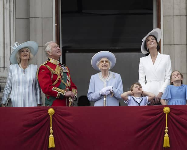 From left, Camilla, Duchess of Cornwall, Prince Charles, Queen Elizabeth II, Prince Louis, Kate, Duchess of Cambridge, Princess Charlotte, Prince George and Prince William gather on the balcony of Buckingham Palace, London, Thursday, June 2, 2022 as they watch a flypast of Royal Air Force aircraft pass over as part of  the Queen's Platinum Jubilee celebrations