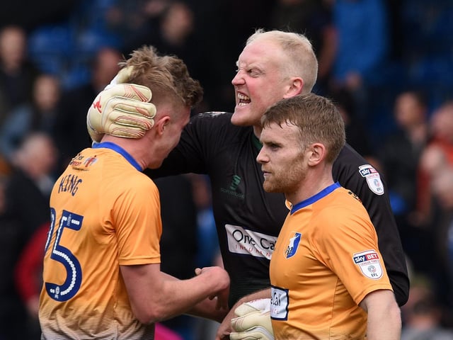 Conrad Logan and team-mates celebrate victory at the final whistle.